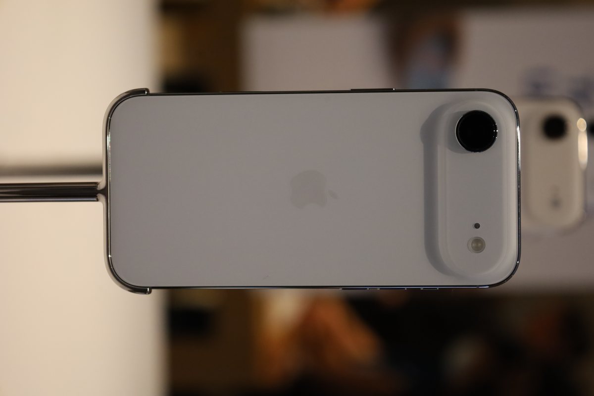 A sky-blue iPhone Air seen from the back