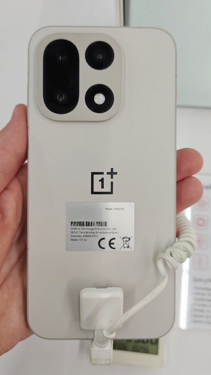 The back of a sand-coloured OnePlus 15